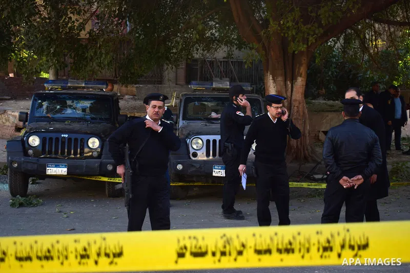 Egyptian special police officers stand guard at the scene of a bomb blast in Giza Al Haram Street on the outskirts of Cairo, Egypt December 9, 2016. Photo by Amr Sayed
