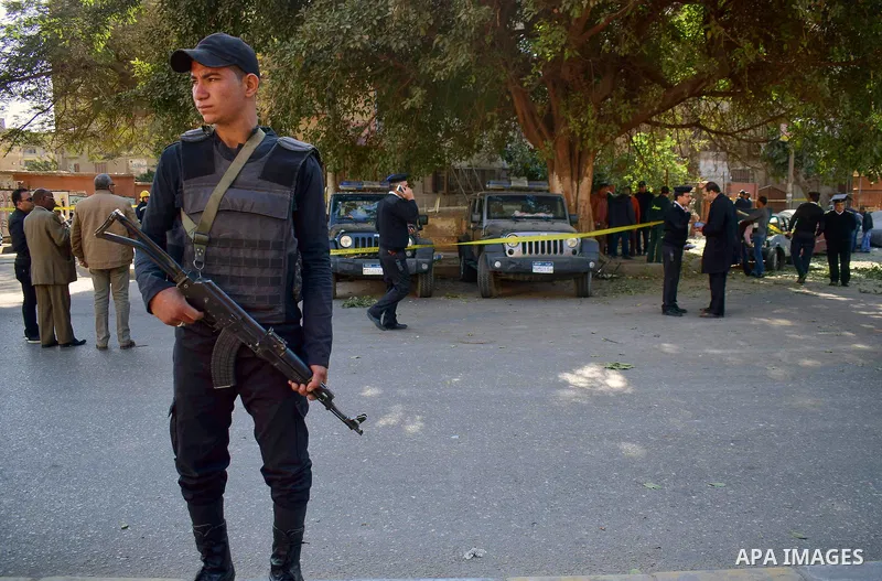 Egyptian special police officers stand guard at the scene of a bomb blast in Giza Al Haram Street on the outskirts of Cairo, Egypt December 9, 2016. Photo by Amr Sayed