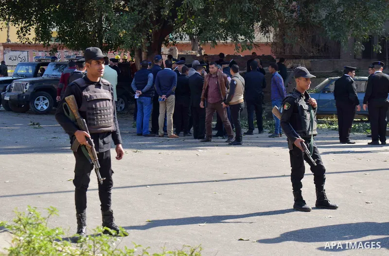 Egyptian special police officers stand guard at the scene of a bomb blast in Giza Al Haram Street on the outskirts of Cairo, Egypt December 9, 2016. Photo by Amr Sayed