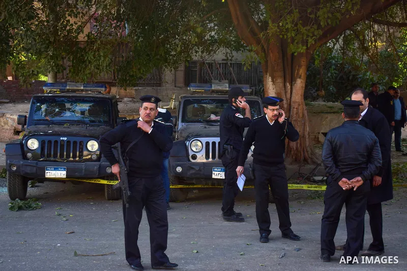Egyptian special police officers stand guard at the scene of a bomb blast in Giza Al Haram Street on the outskirts of Cairo, Egypt December 9, 2016. Photo by Amr Sayed