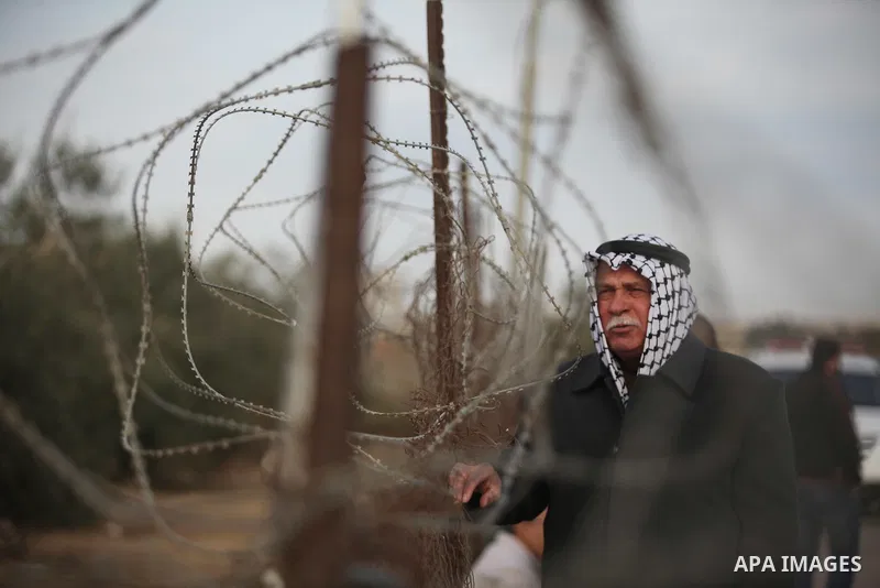 Palestinians wait for travel permits to cross into Egypt through the Rafah border crossing after it was opened by Egyptian authorities for humanitarian cases, in Rafah in the southern Gaza Strip December 10, 2016. An off...