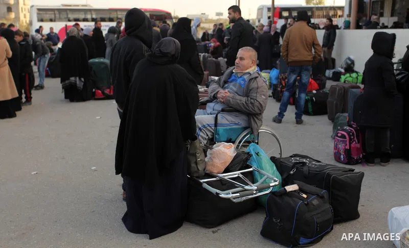 Palestinians wait for travel permits to cross into Egypt through the Rafah border crossing after it was opened by Egyptian authorities for humanitarian cases, in Rafah in the southern Gaza Strip December 10, 2016. An off...