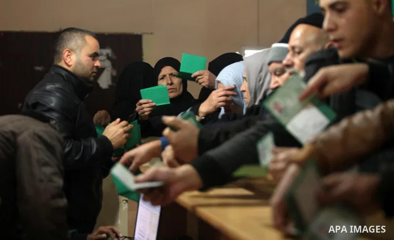 Palestinians wait for travel permits to cross into Egypt through the Rafah border crossing after it was opened by Egyptian authorities for humanitarian cases, in Rafah in the southern Gaza Strip December 10, 2016. An off...