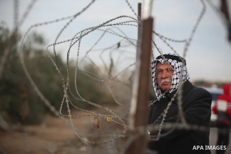 Palestinians wait for travel permits to cross into Egypt through the Rafah border crossing after it was opened by Egyptian authorities for humanitarian cases, in Rafah in the southern Gaza Strip December 10, 2016. An off...