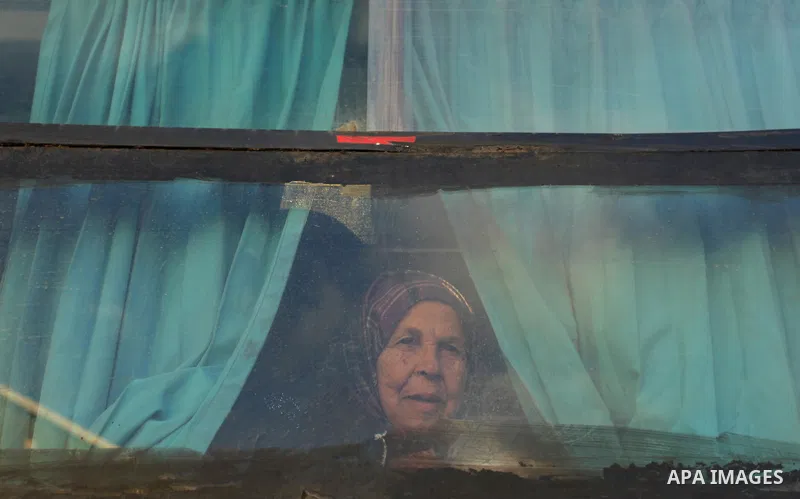 Palestinians wait for travel permits to cross into Egypt through the Rafah border crossing after it was opened by Egyptian authorities for humanitarian cases, in Rafah in the southern Gaza Strip December 10, 2016. An off...