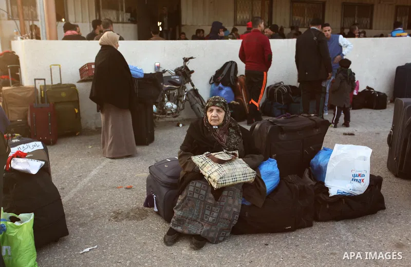 Palestinians wait for travel permits to cross into Egypt through the Rafah border crossing after it was opened by Egyptian authorities for humanitarian cases, in Rafah in the southern Gaza Strip December 10, 2016. An off...