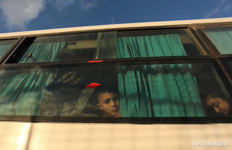Palestinians wait for travel permits to cross into Egypt through the Rafah border crossing after it was opened by Egyptian authorities for humanitarian cases, in Rafah in the southern Gaza Strip December 10, 2016. An off...