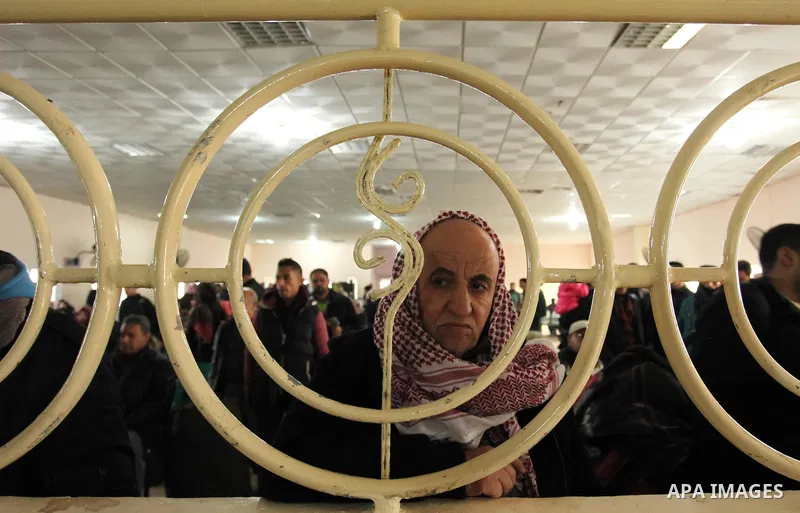 Palestinians wait for travel permits to cross into Egypt through the Rafah border crossing after it was opened by Egyptian authorities for humanitarian cases, in Rafah in the southern Gaza Strip December 10, 2016. An off...