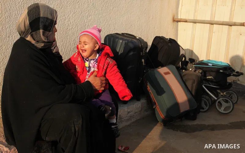 Palestinians wait for travel permits to cross into Egypt through the Rafah border crossing after it was opened by Egyptian authorities for humanitarian cases, in Rafah in the southern Gaza Strip December 10, 2016. An off...