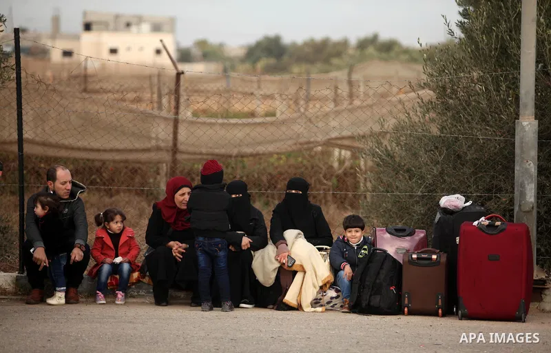 Palestinians wait for travel permits to cross into Egypt through the Rafah border crossing after it was opened by Egyptian authorities for humanitarian cases, in Rafah in the southern Gaza Strip December 10, 2016. An off...
