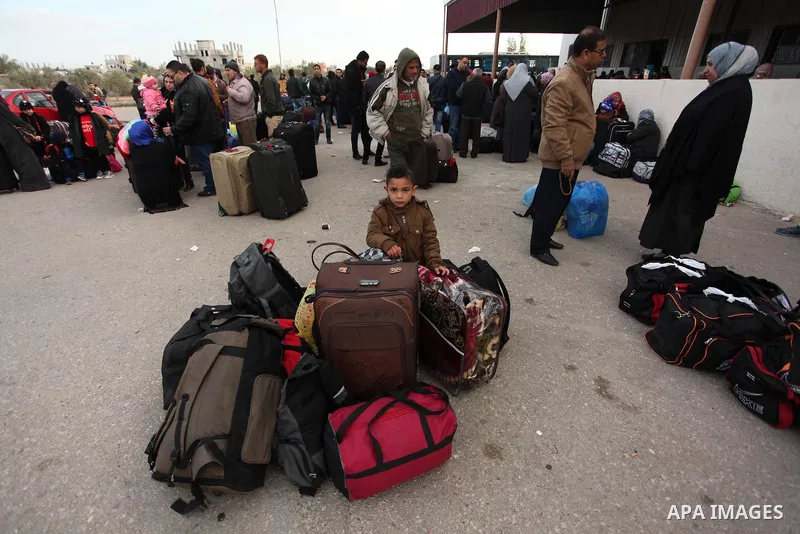 Palestinians wait for travel permits to cross into Egypt through the Rafah border crossing after it was opened by Egyptian authorities for humanitarian cases, in Rafah in the southern Gaza Strip December 10, 2016. An off...