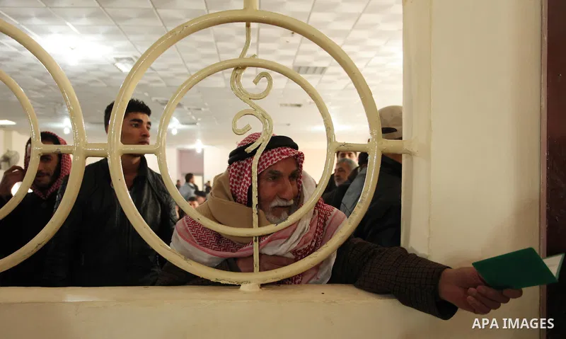 Palestinians wait for travel permits to cross into Egypt through the Rafah border crossing after it was opened by Egyptian authorities for humanitarian cases, in Rafah in the southern Gaza Strip December 10, 2016. An off...