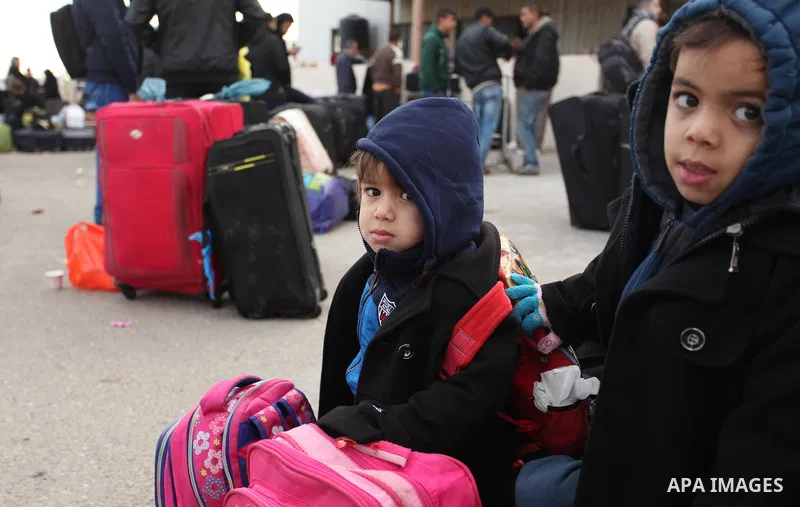 Palestinians wait for travel permits to cross into Egypt through the Rafah border crossing after it was opened by Egyptian authorities for humanitarian cases, in Rafah in the southern Gaza Strip December 10, 2016. An off...
