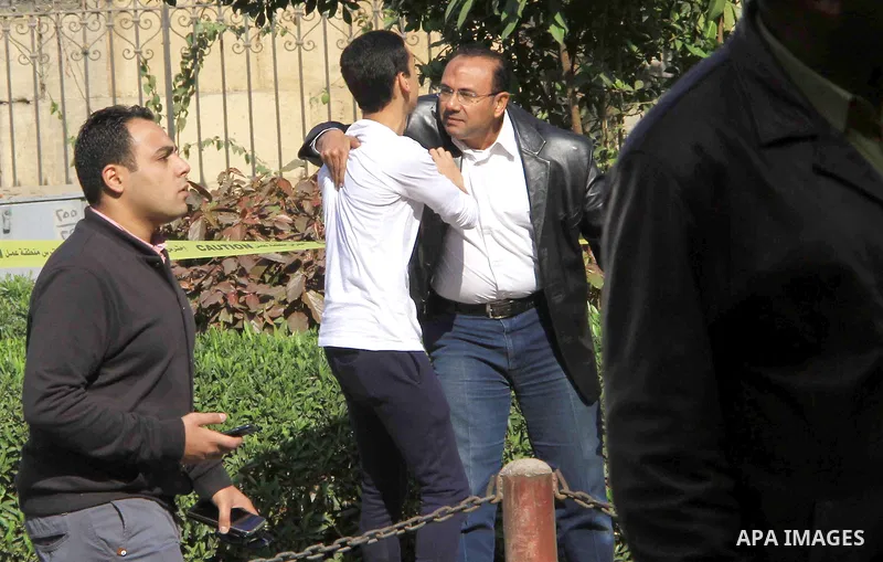 A relative of one of the blast victims reacts at the scene of a bomb explosion at the Saint Peter and Saint Paul Coptic Orthodox Church on December 11, 2016, in Cairo's Abbasiya neighbourhood. The blast killed at least 2...