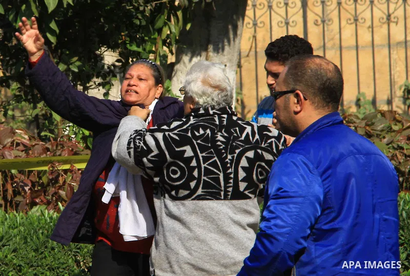A relative of one of the blast victims reacts at the scene of a bomb explosion at the Saint Peter and Saint Paul Coptic Orthodox Church on December 11, 2016, in Cairo's Abbasiya neighbourhood. The blast killed at least 2...