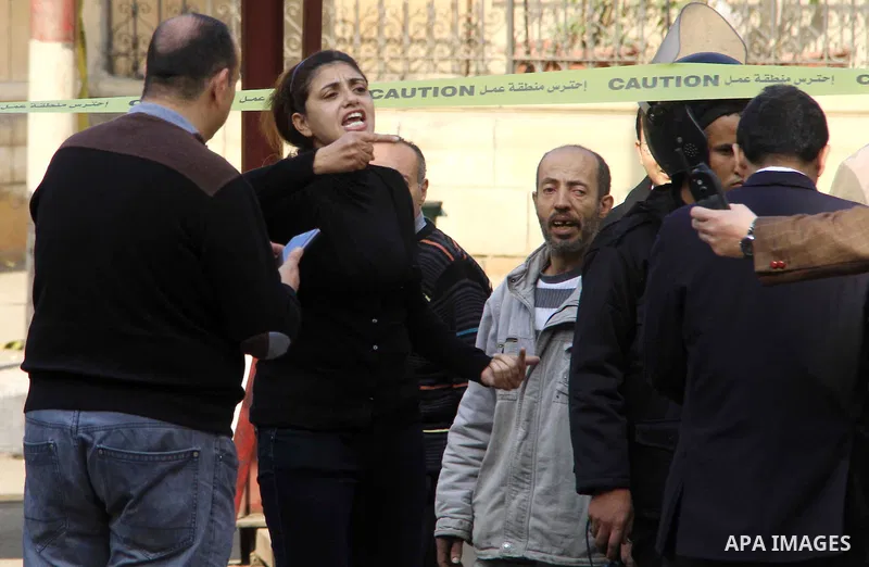 A relative of one of the blast victims reacts at the scene of a bomb explosion at the Saint Peter and Saint Paul Coptic Orthodox Church on December 11, 2016, in Cairo's Abbasiya neighbourhood. The blast killed at least 2...