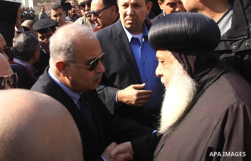 Egyptian Prime Minister Sherif Ismail checks the damaged Saint Peter and Saint Paul Coptic Orthodox Church after a bombing on December 11, 2016, in Cairo's Abbasiya neighbourhood. The blast killed at least 25 worshippers...