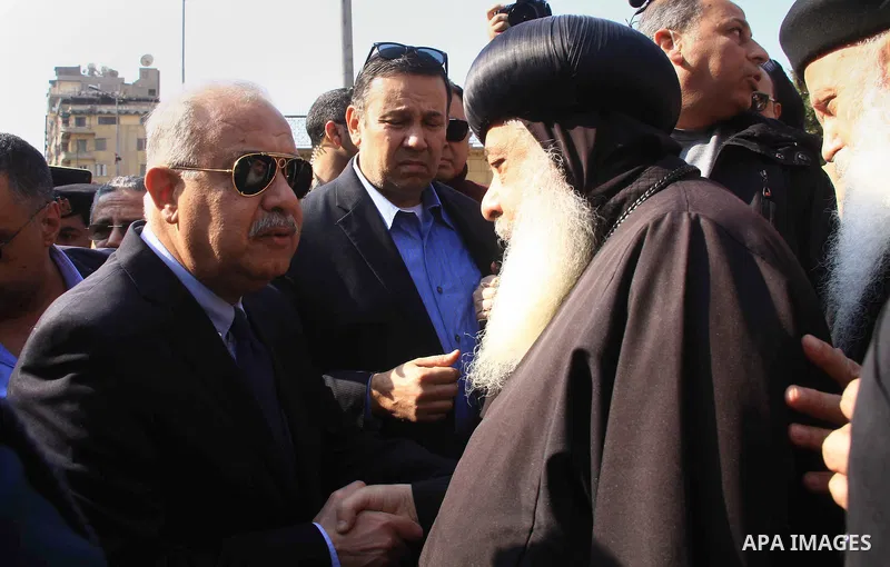 Egyptian Prime Minister Sherif Ismail checks the damaged Saint Peter and Saint Paul Coptic Orthodox Church after a bombing on December 11, 2016, in Cairo's Abbasiya neighbourhood. The blast killed at least 25 worshippers...