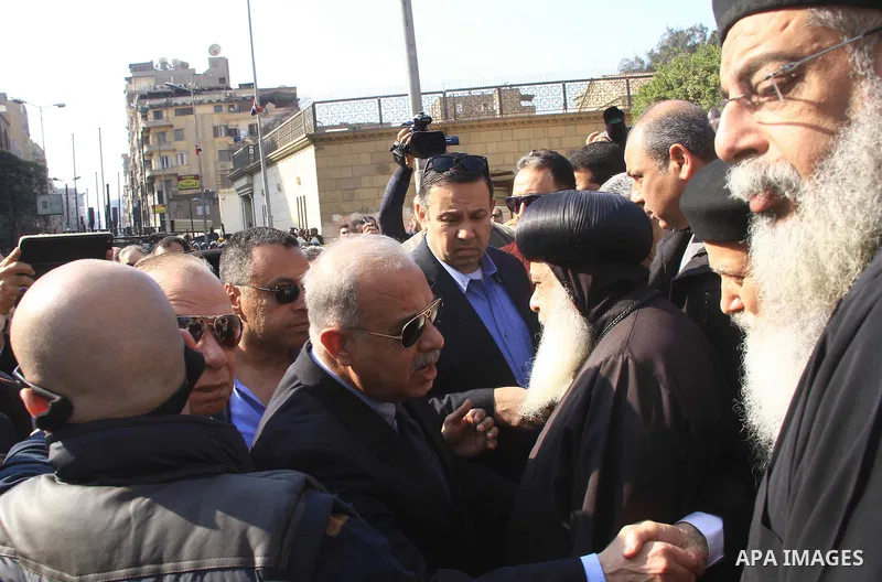Egyptian Prime Minister Sherif Ismail checks the damaged Saint Peter and Saint Paul Coptic Orthodox Church after a bombing on December 11, 2016, in Cairo's Abbasiya neighbourhood. The blast killed at least 25 worshippers...