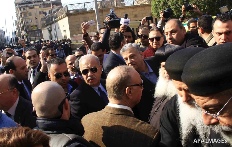 Egyptian Prime Minister Sherif Ismail checks the damaged Saint Peter and Saint Paul Coptic Orthodox Church after a bombing on December 11, 2016, in Cairo's Abbasiya neighbourhood. The blast killed at least 25 worshippers...