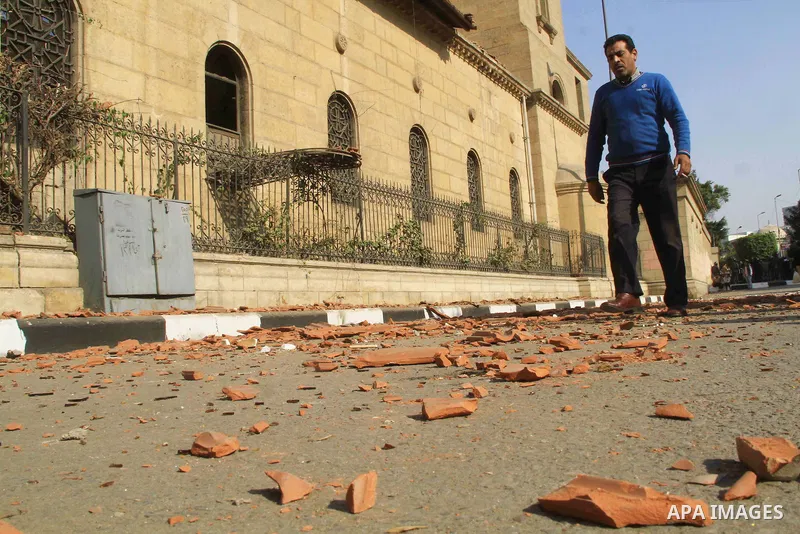 A picture shows the damaged Saint Peter and Saint Paul Coptic Orthodox Church after a bombing on December 11, 2016, in Cairo's Abbasiya neighbourhood. The blast killed at least 25 worshippers during Sunday mass inside th...