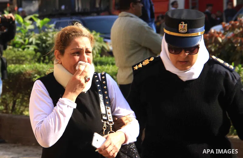 A relative of one of the blast victims reacts at the scene of a bomb explosion at the Saint Peter and Saint Paul Coptic Orthodox Church on December 11, 2016, in Cairo's Abbasiya neighbourhood. The blast killed at least 2...