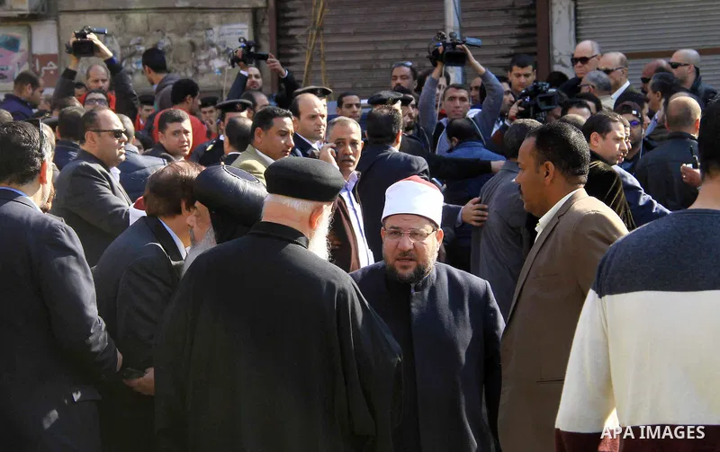 Egyptians inspect the scene of a bomb explosion at the Saint Peter and Saint Paul Coptic Orthodox Church on December 11, 2016, in Cairo's Abbasiya neighbourhood. The blast killed at least 25 worshippers during Sunday mas...