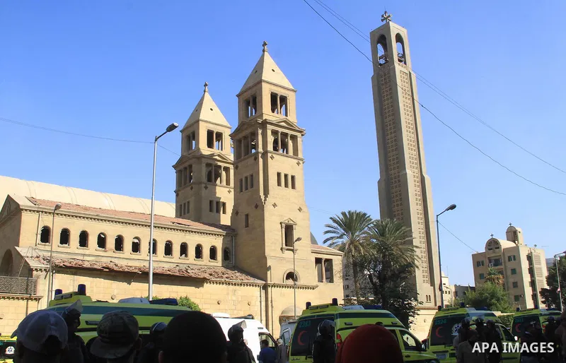 Egyptians inspect the scene of a bomb explosion at the Saint Peter and Saint Paul Coptic Orthodox Church on December 11, 2016, in Cairo's Abbasiya neighbourhood. The blast killed at least 25 worshippers during Sunday mas...