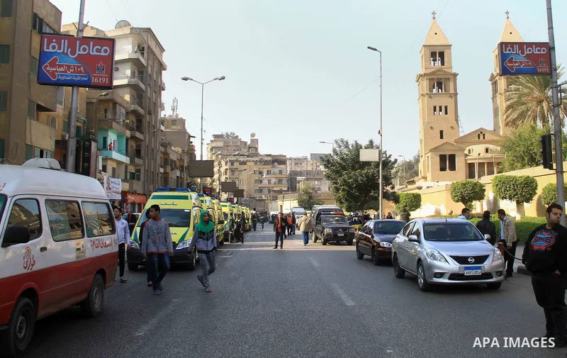 Egyptians inspect the scene of a bomb explosion at the Saint Peter and Saint Paul Coptic Orthodox Church on December 11, 2016, in Cairo's Abbasiya neighbourhood. The blast killed at least 25 worshippers during Sunday mas...