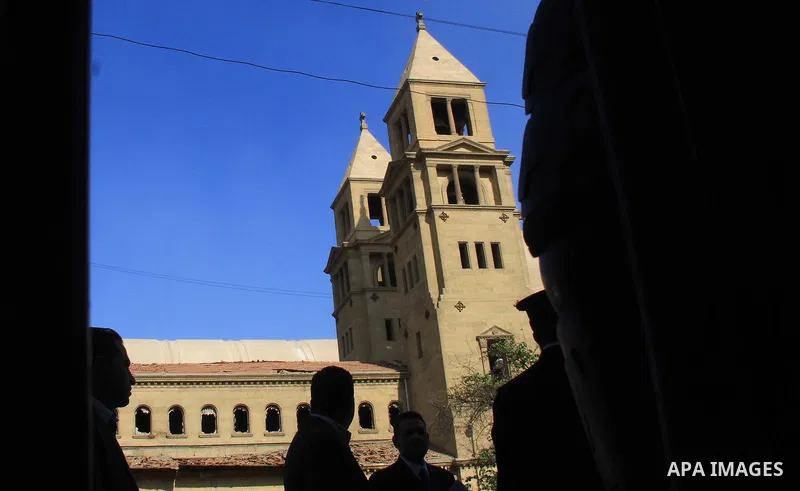 Egyptians inspect the scene of a bomb explosion at the Saint Peter and Saint Paul Coptic Orthodox Church on December 11, 2016, in Cairo's Abbasiya neighbourhood. The blast killed at least 25 worshippers during Sunday mas...
