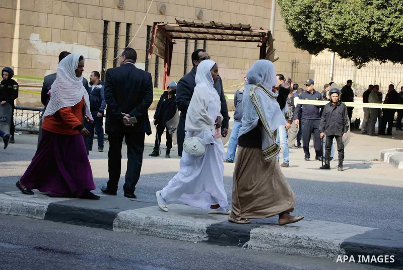 Members of the special police forces stand guard outside the Saint Peter and Saint Paul Coptic Orthodox Church in Cairo's Abbasiya neighbourhood after it was targeted by a bomb explosion on December 11, 2016, . The blast...
