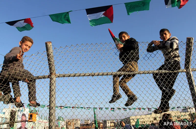 Palestinians take part in a rally marking the 29th anniversary of the founding of the Hamas movement, in Khan Younis in the southern Gaza Strip December 11, 2016. Photo by Abed Rahim Khatib