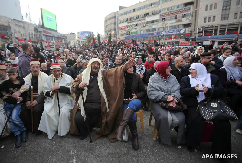 Palestinians Muslim Sufis attend a ceremony commemorating the birth of Prophet Mohammed, known in Arabic as "Mawlid al-Nabawi", in the West Bank city of Nablus on December 11, 2016. Photo by Nedal Eshtayah
