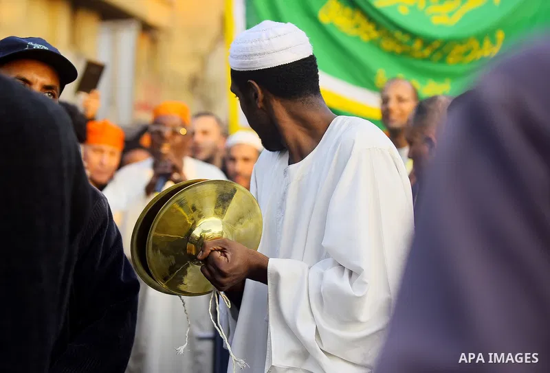 Egyptian Sufi Muslims chant prayers while walking in a march with banners as they celebrate "Mawlid al-Nabawi" or the birth of Prophet Mohammad, in old Cairo, Egypt, on December 11, 2016. Photo by Amr Sayed