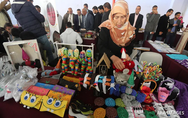Palestinians attend an exhibition for disabled, at the Al-Aqsa University in Gaza City, on December 12, 2016. Photo by Mohammed Asad