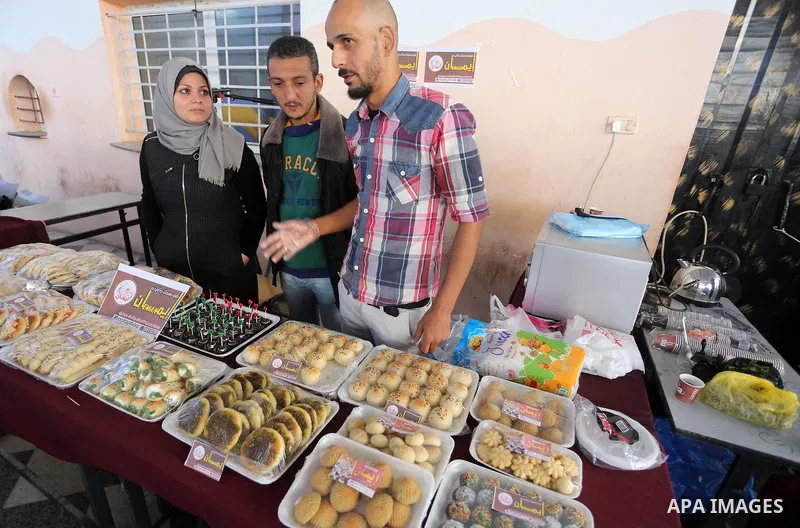 Palestinians attend an exhibition for disabled, at the Al-Aqsa University in Gaza City, on December 12, 2016. Photo by Mohammed Asad