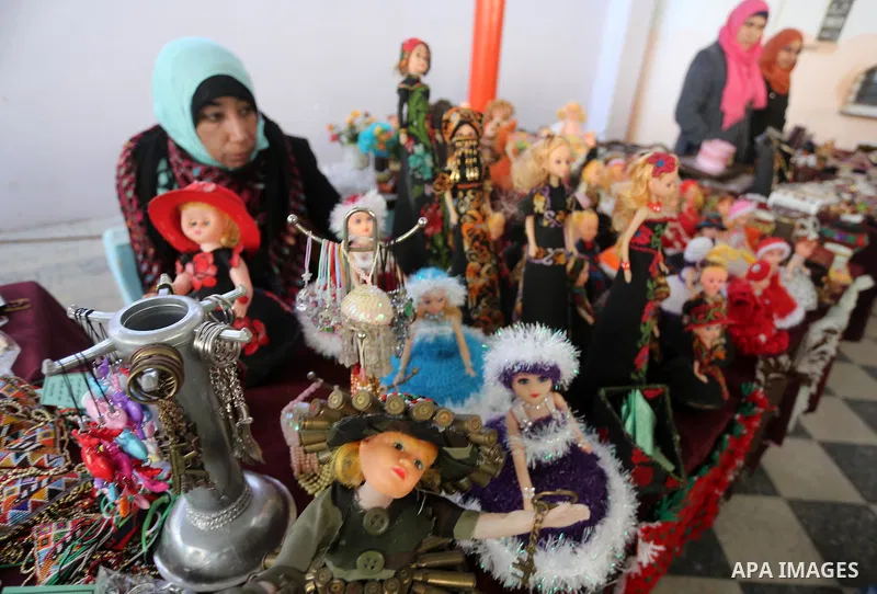 Palestinians attend an exhibition for disabled, at the Al-Aqsa University in Gaza City, on December 12, 2016. Photo by Mohammed Asad