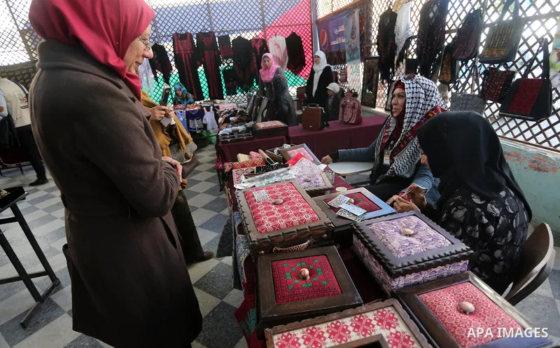Palestinians attend an exhibition for disabled, at the Al-Aqsa University in Gaza City, on December 12, 2016. Photo by Mohammed Asad