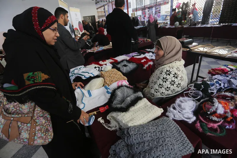Palestinians attend an exhibition for disabled, at the Al-Aqsa University in Gaza City, on December 12, 2016. Photo by Mohammed Asad