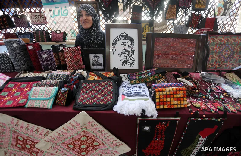 Palestinians attend an exhibition for disabled, at the Al-Aqsa University in Gaza City, on December 12, 2016. Photo by Mohammed Asad