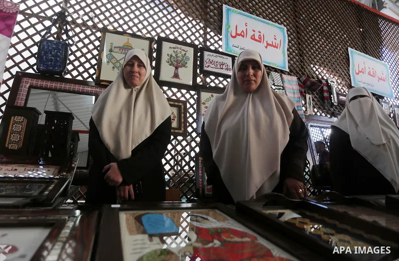 Palestinians attend an exhibition for disabled, at the Al-Aqsa University in Gaza City, on December 12, 2016. Photo by Mohammed Asad