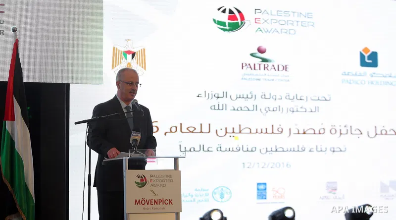 Palestinian Prime Minister Rami Hamdallah, attends the opening ceremony of the Palestine exporter Award 2016, in the Wes bank city of Ramallah, on December 12, 2016. Photo by Prime Minister Office
