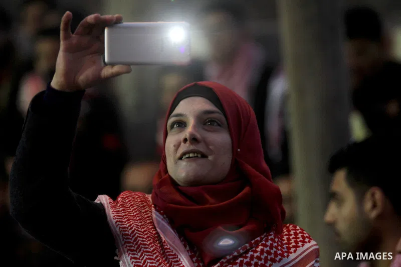 Palestinians take part in a rally marking the 49th anniversary of the founding of the Popular Front for the Liberation of Palestine (PFLP), in the village of Asira Shamaliya, north of the West Bank city of Nablus on 12 D...