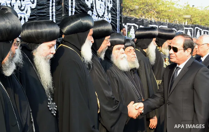 Egyptian President Abdel Fattah al-Sisi attends the funeral of the victims of a bomb explosion that targeted a Coptic Orthodox Church in Cairo, on December 12, 2016. Photo by Egyptian President Office