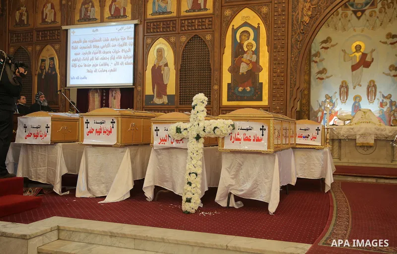 Coffins are laid out during a funeral of the victims of a bomb explosion that targeted a Coptic Orthodox Church the previous day in Cairo, in the Egyptian capital's Nassr City neighbourhood on December 12, 2016. Photo by...