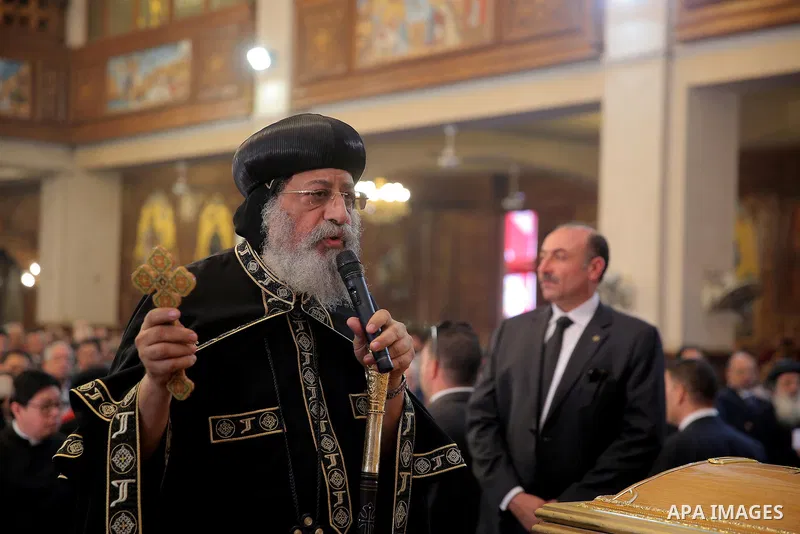 Egypt's Coptic Pope Tawadros II leads the funeral of the victims of a bomb explosion that targeted a Coptic Orthodox Church the previous day in Cairo, during their funeral in the Egyptian capital's Nassr City neighbourho...