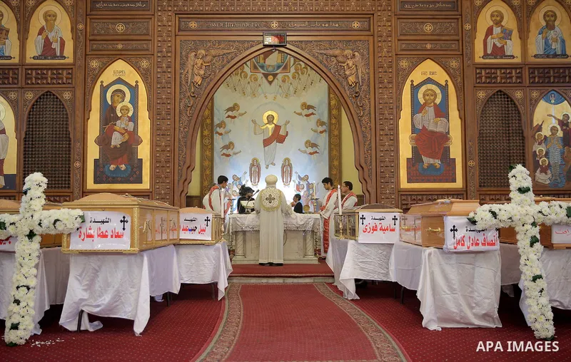 Coffins are laid out during a funeral of the victims of a bomb explosion that targeted a Coptic Orthodox Church the previous day in Cairo, in the Egyptian capital's Nassr City neighbourhood on December 12, 2016. Photo by...