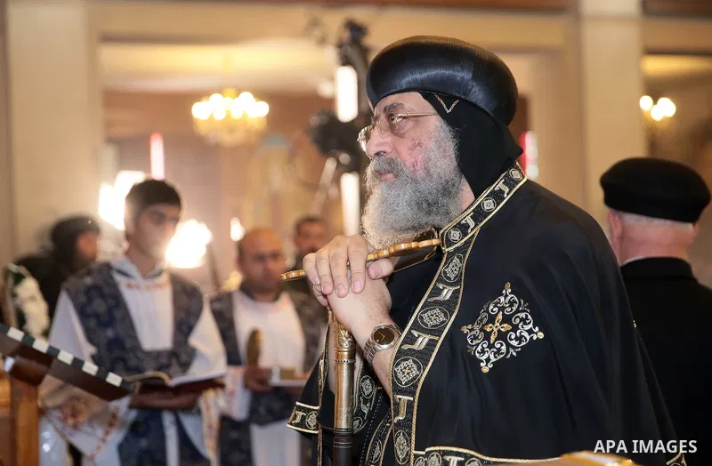 Egypt's Coptic Pope Tawadros II leads the funeral of the victims of a bomb explosion that targeted a Coptic Orthodox Church the previous day in Cairo, during their funeral in the Egyptian capital's Nassr City neighbourho...