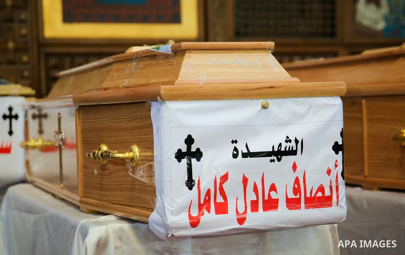 Coffins are laid out during a funeral of the victims of a bomb explosion that targeted a Coptic Orthodox Church the previous day in Cairo, in the Egyptian capital's Nassr City neighbourhood on December 12, 2016. Photo by...
