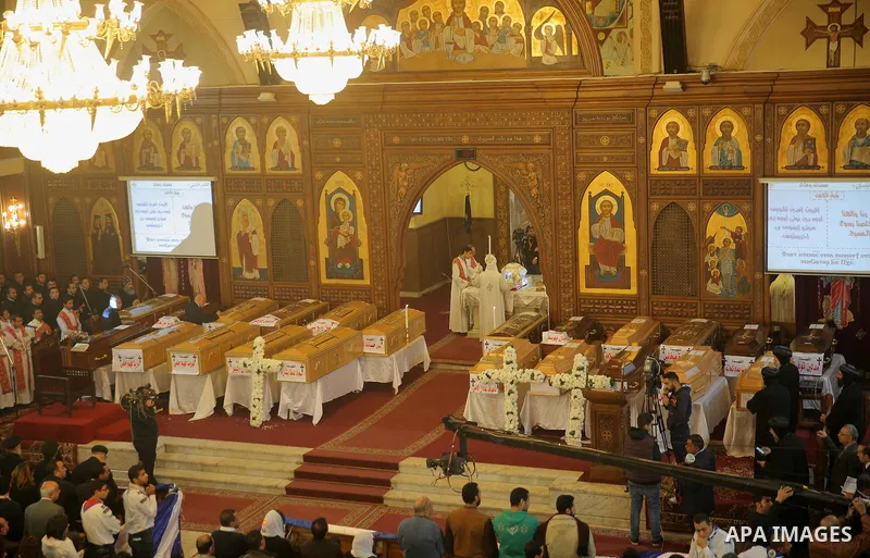 Coffins are laid out during a funeral of the victims of a bomb explosion that targeted a Coptic Orthodox Church the previous day in Cairo, in the Egyptian capital's Nassr City neighbourhood on December 12, 2016. Photo by...
